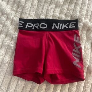 red pink nike pros